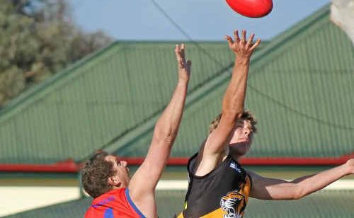 Redbacks player Dennis Ganley (4) contests the ball at the centre bounce on Saturday. Redbacks player Dennis Ganley (4) contests the ball at the centre bounce on Saturday.